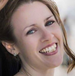 Woman smiling brightly outdoors